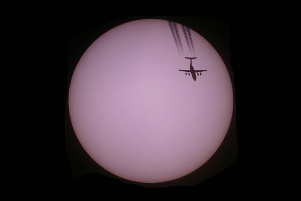 BAe 146 Avro Regional Jet flying in front of the sun